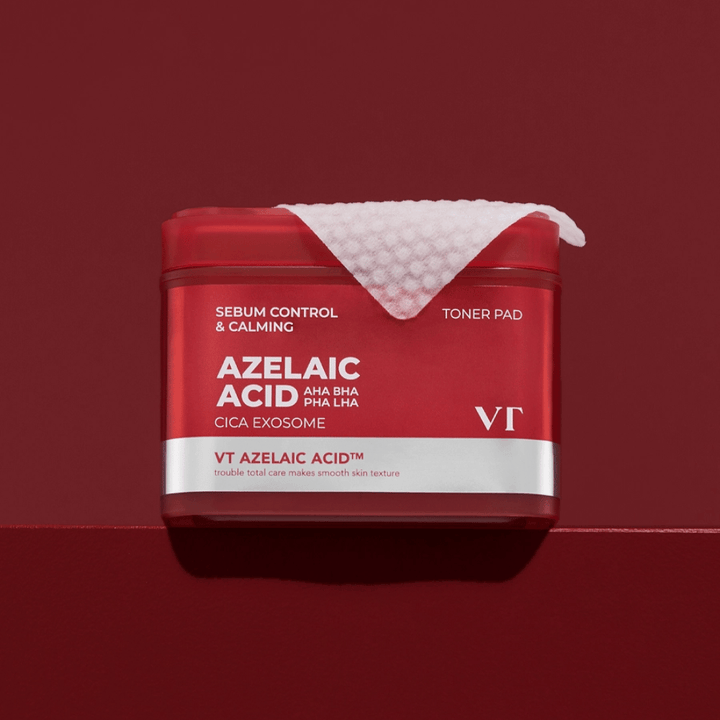 VT Azelaic Acid Toner Pad – punainen purkki tekstuurityynyllä, täydellinen tasoittamaan ihonsävyä ja vähentämään epäpuhtauksia.