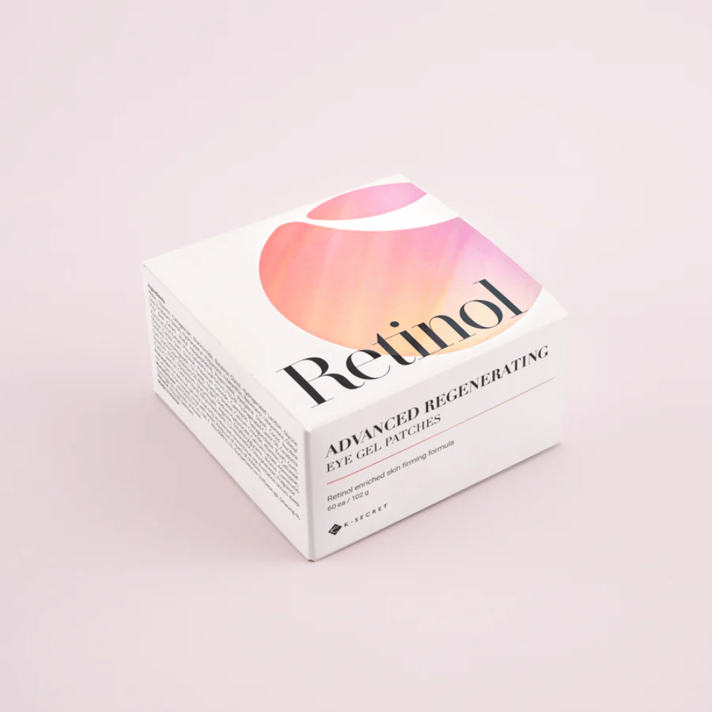 Pakkaus K-Secret Advanced Regenerating Eye Gel Patches retinolilla, valkoisessa ja vaaleanpunaisessa suunnittelussa.