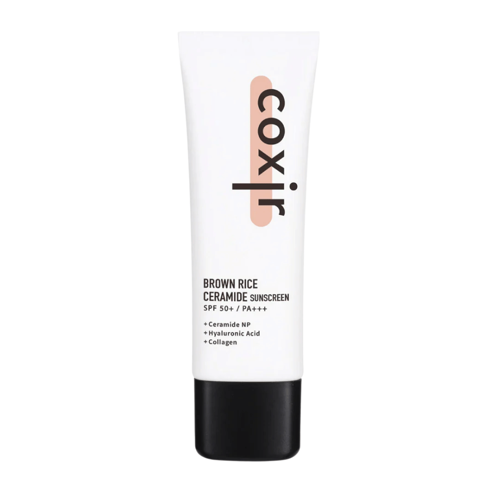Tuotekuva Coxir Brown Rice Ceramide Sunscreen valkoisessa tuubissa mustalla korkilla, SPF 50+ PA+++, sisältää keramideja, hyaluronihappoa ja kollageenia.