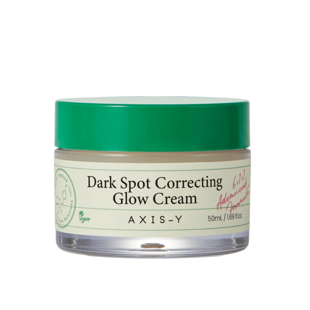 Purkillinen "AXIS-Y Dark Spot Correcting Glow Cream". Tämä voide on tarkoitettu tummien läiskien korjaamiseen ja ihon hehkun lisäämiseen. Pakkaus on tyylikäs, läpinäkyvällä pohjalla ja näyttävällä vihreällä kannella.