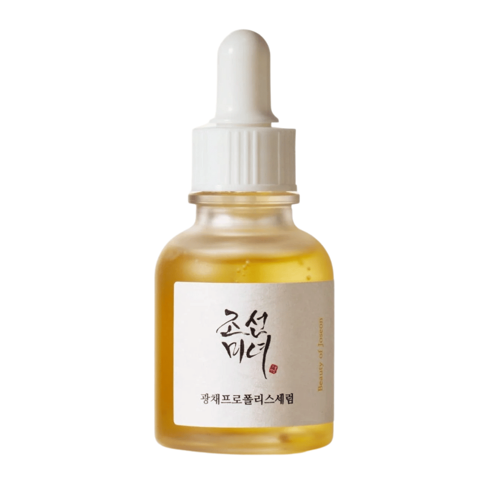 Pullo Beauty of Joseon Glow Serum valkoisella pipetillä ja kultaisella seerumilla, heleyttävä tuote propoliksella ja niasiiniamidilla.