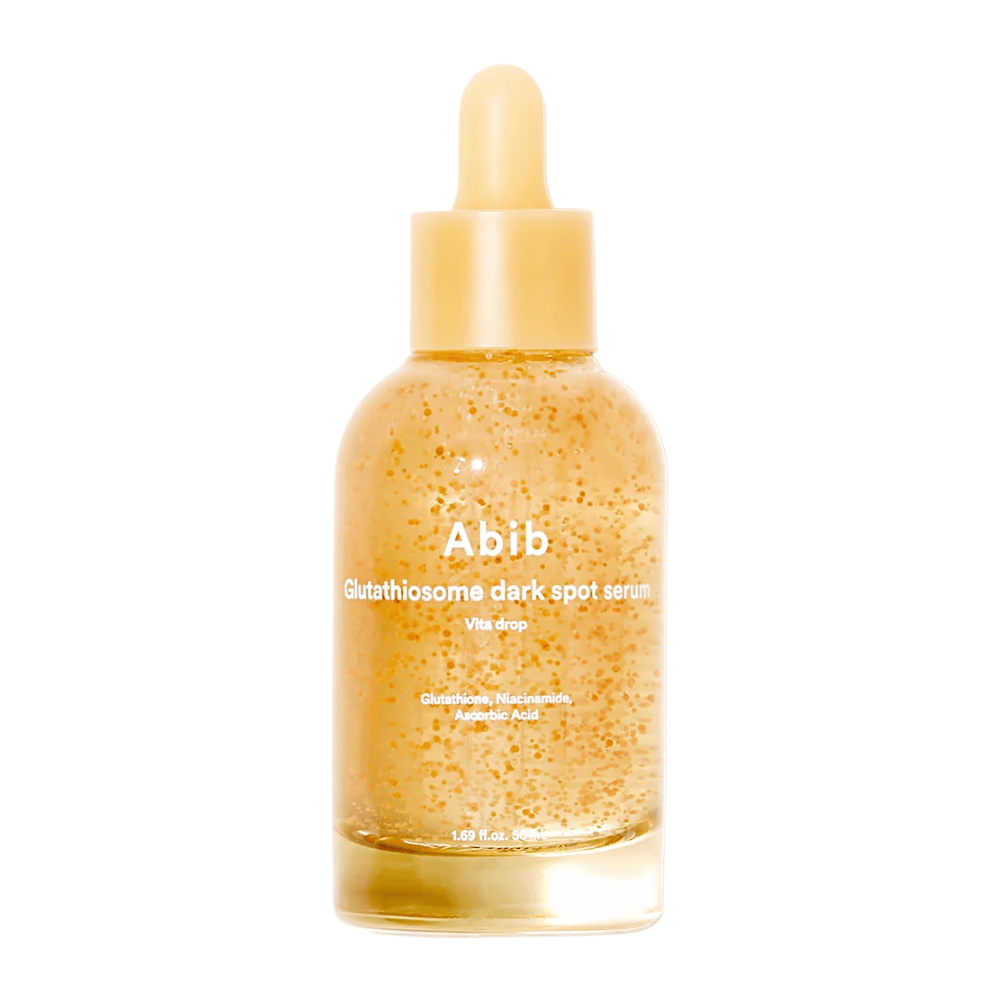 Tuotekuva Abib Glutathiosome Dark Spot Serum Vita Drop läpinäkyvässä lasipullossa, jossa on keltainen pipetti ja näkyviä mikrokapseleita seerumissa.