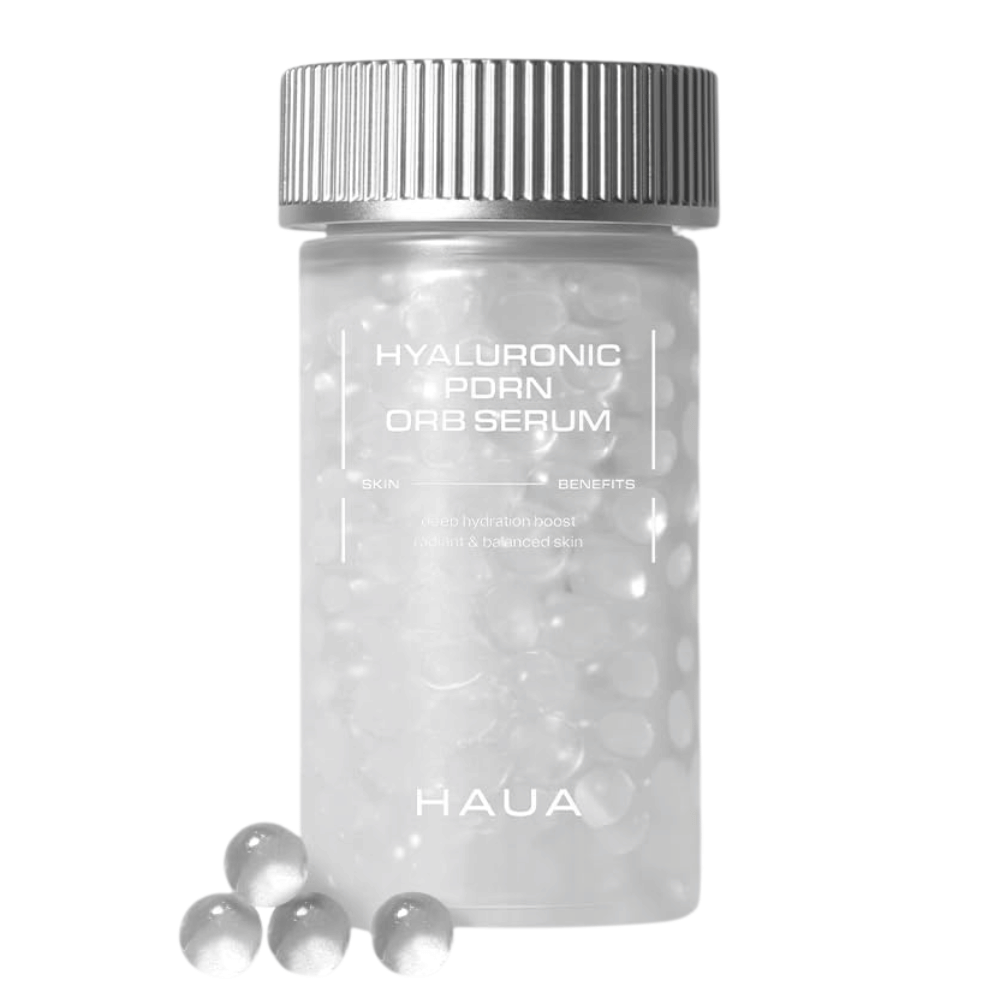 Tuotekuva tuotteesta HAUA Hyaluronic PDRN Orb Serum valkoisella taustalla. Läpinäkyvä säiliö on täytetty seerumipalloilla ja korostaa tuotteen ainutlaatuista kapseloitua koostumusta.