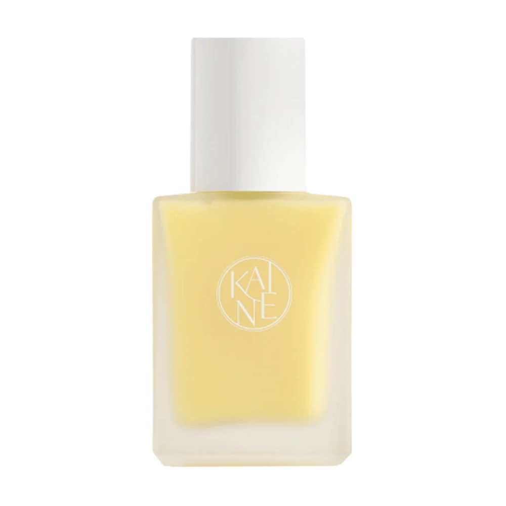 Keltainen Vita Drop Serum 30ml pullo valkoisella taustalla KAINE ihonhoitotuotteiden kanssa.