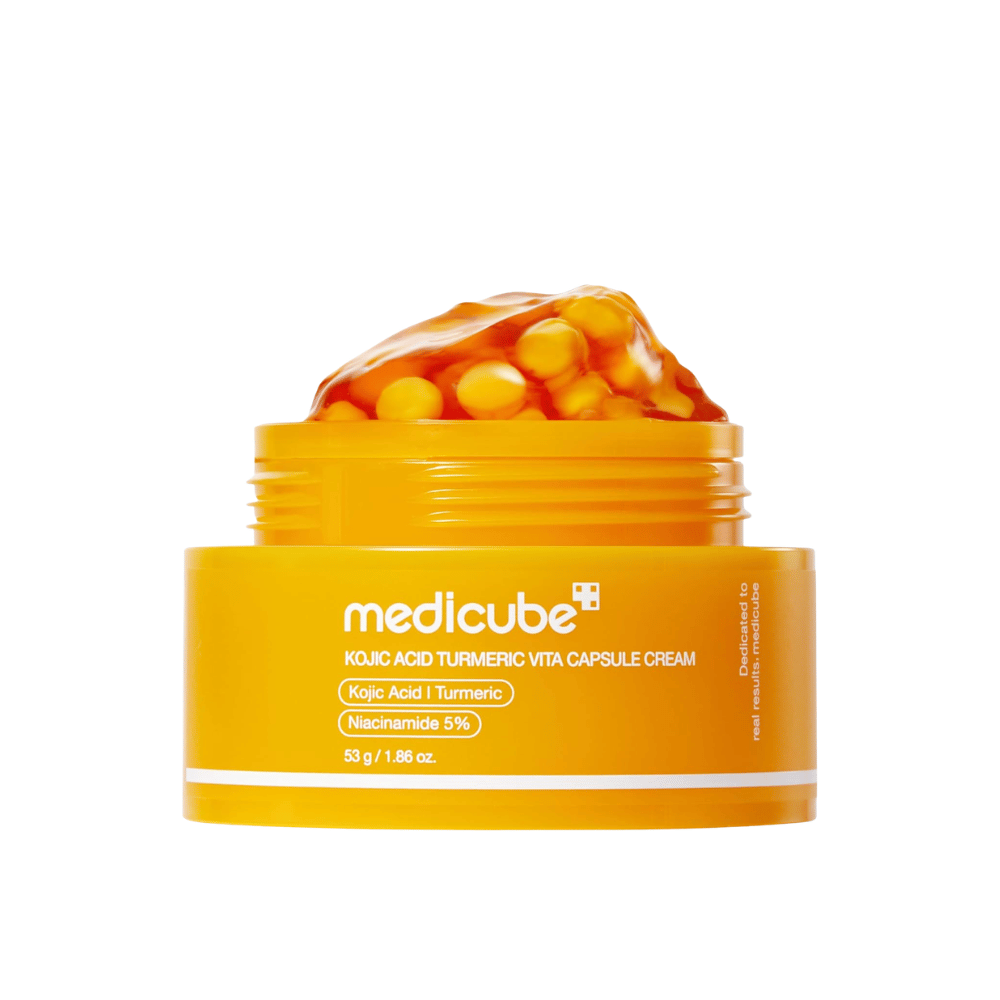 5. Medicube Kojic Acid Turmeric Vita Capsule Cream 53 g – keltainen purkki, jossa geelimäinen voide ja kapselit valkoisella taustalla
