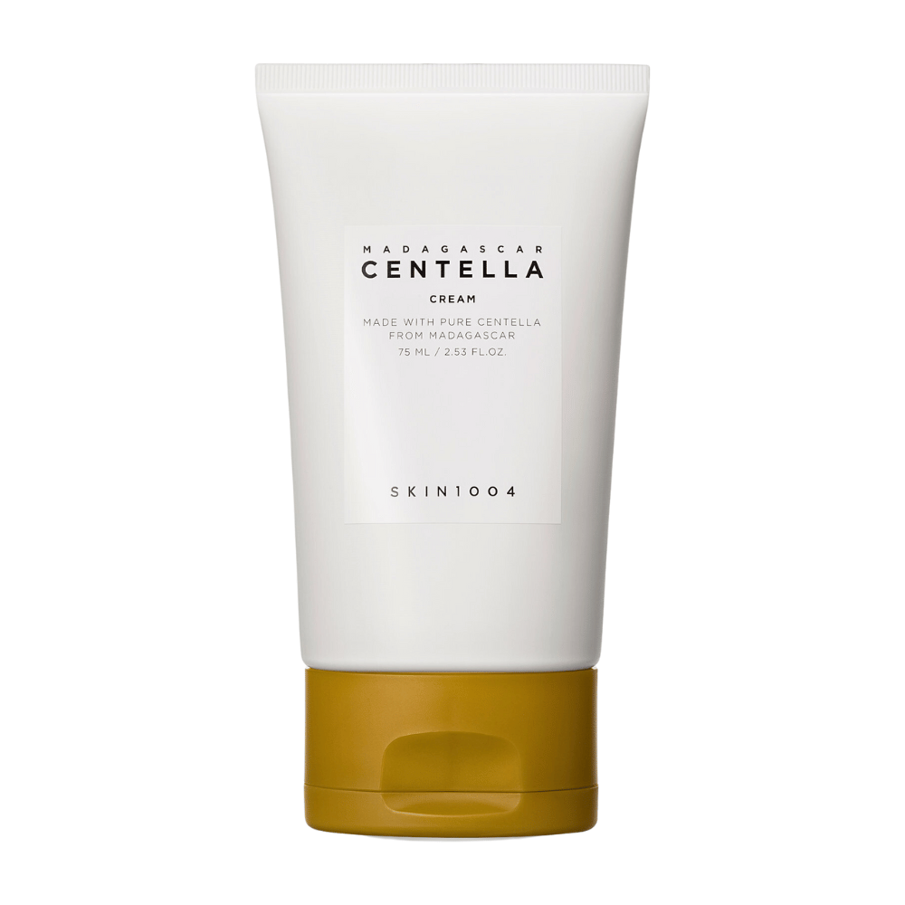 Kuva näyttää tuubin, jossa on "Madagascar Centella Cream" SKIN1004. Se on ihovoide, joka on valmistettu puhtaasta Madagaskarin Centellasta ja tulee 75 ml / 2,53 fl.oz. pakkauksessa. Tuote on tarkoitettu ihonhoitoon, tarjoamaan ravintoa ja kosteutta iholle.