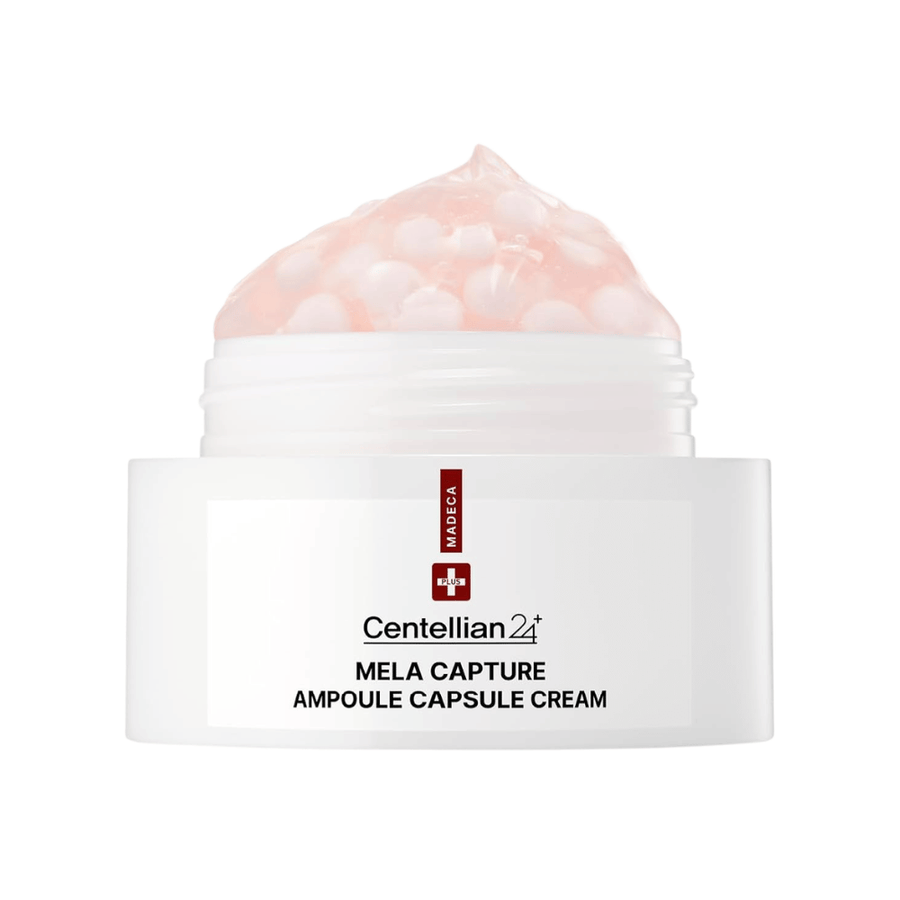 Lähikuva tuotteesta Centellian24 Madeca Mela Capture Ampoule Capsule Cream, jossa näkyy purkissa oleva vaaleanpunainen geelivoide, jossa on kapseloituja ampullihelmiä.