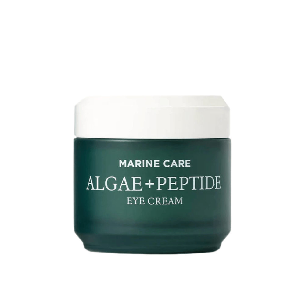 Heimish Marine Care Algae + Peptide Eye Cream tummanvihreässä purkissa, jossa on valkoinen kansi. Silmänympärysvoide, joka on rikastettu levillä ja peptideillä kosteuttamaan, kirkastamaan ja vähentämään hienoja juonteita silmien ympärillä.
