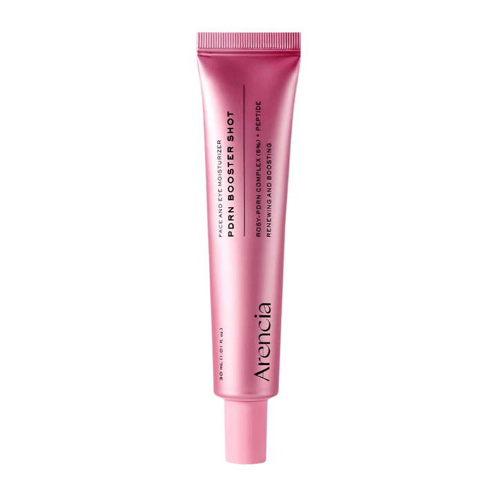 Puhdas tuotekuva tuotteesta Arencia PDRN Booster Shot, jossa on minimalistinen vaaleanpunainen pakkaus ja painotus kosteuttavaan, uudistavaan ja hehkua antavaan ihonhoitoon.