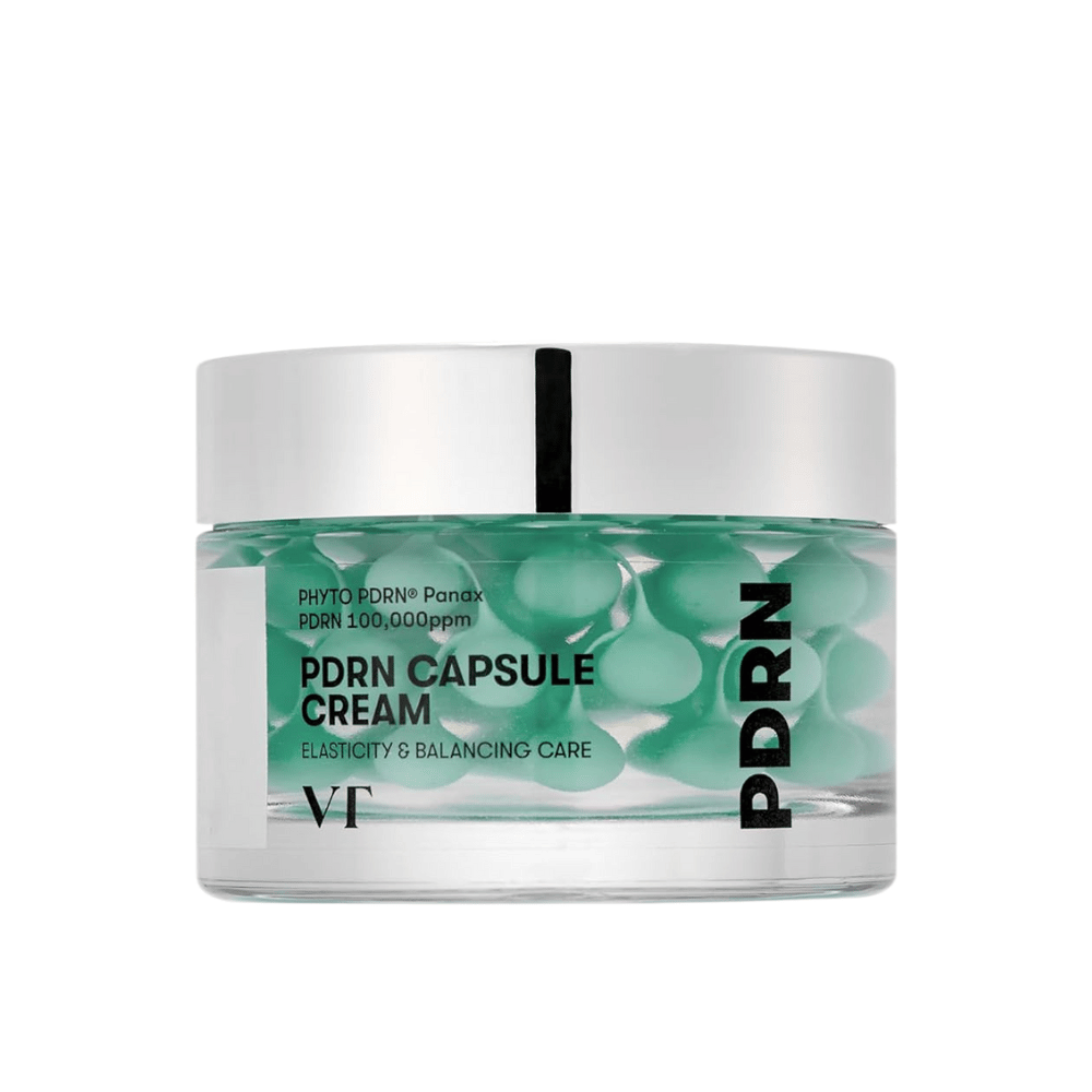VT PDRN Capsule Cream läpinäkyvässä purkissa, jossa on hopeakansi. Sisältö koostuu vihreistä kapseleista kirkkaassa geelissä, ja etiketissä kerrotaan, että voide on tarkoitettu elastisuuden ja tasapainottavan ihonhoidon edistämiseen.