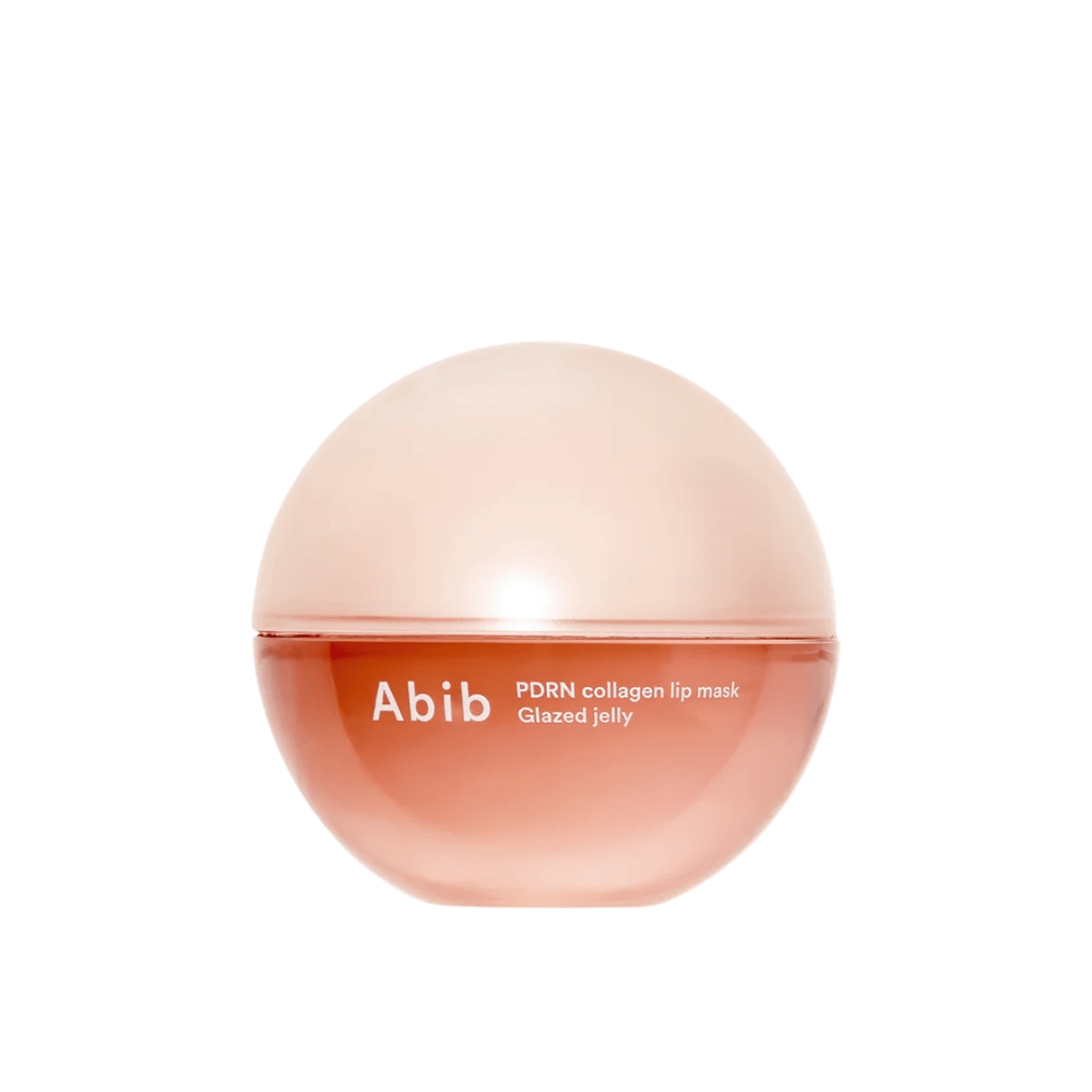 Vaaleanpunainen pyöreä purkki, jonka etupuolella on teksti "Abib PDRN Collagen Lip Mask Glazed Jelly", valkoista taustaa vasten valokuvattuna.