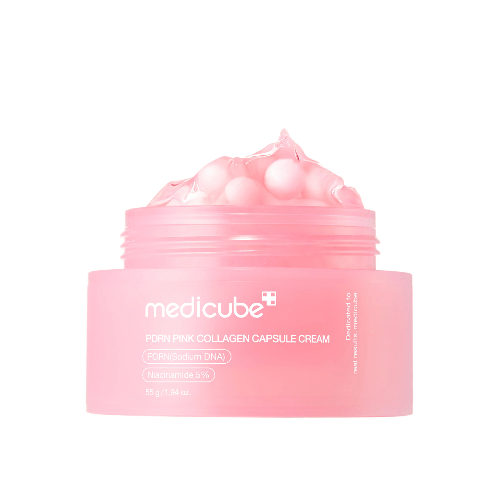 Tuotekuva Medicube PDRN Pink Collagen Capsule Cream näkyvillä vaaleanpunaisilla kapseleilla läpinäkyvässä vaaleanpunaisessa purkissa, suunniteltu kosteuttamaan ja tasoittamaan ihonsävyä.