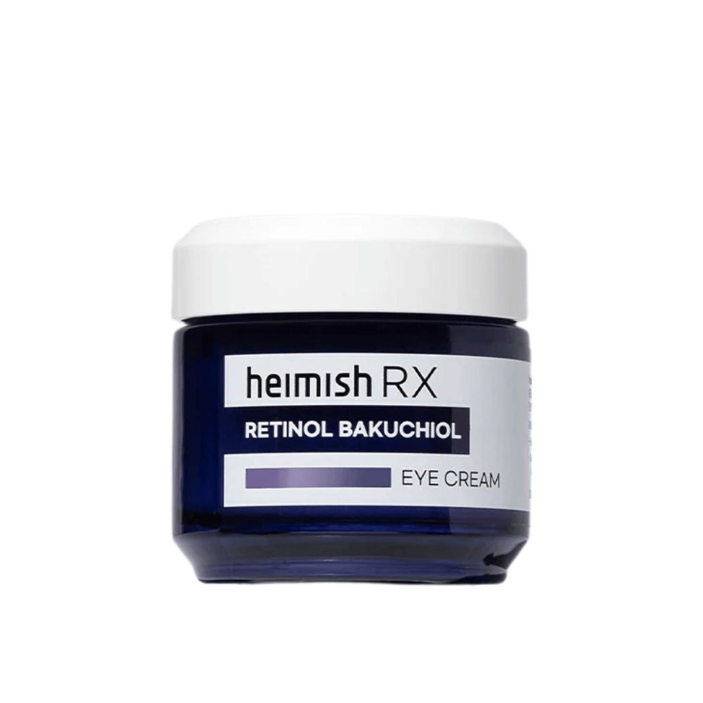 Heimish RX Retinol Bakuchiol Eye Cream tummansinisessä purkissa, jossa on valkoinen kansi. Silmänympärysvoide, joka on rikastettu retinolilla ja bakuchiolilla sileämmän ja kiinteämmän ihon saavuttamiseksi silmien ympärillä.