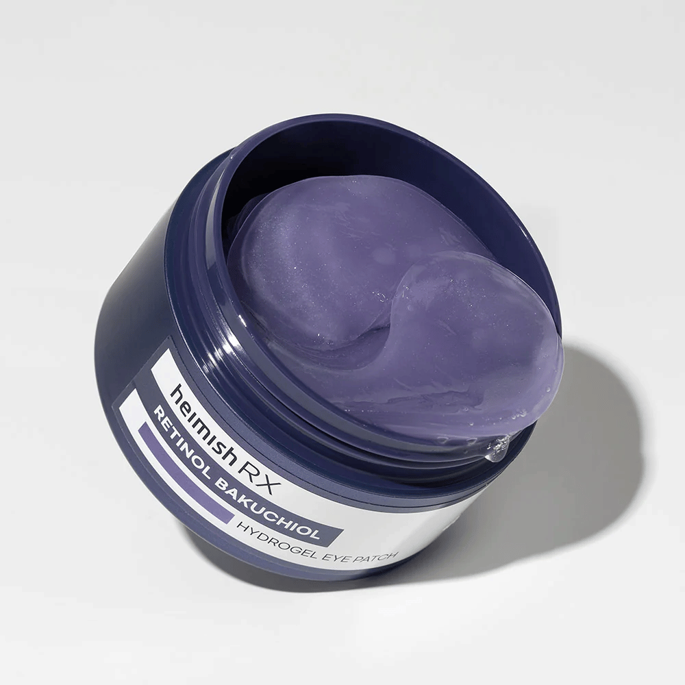 Heimish RX Retinol Bakuchiol Hydrogel Eye Patch tummansinisessä purkissa, jossa on violetit hydrogeelisilmänympäryslaput. Tuote on suunniteltu kosteuttamaan ja vähentämään hienoja juonteita silmien ympärillä.