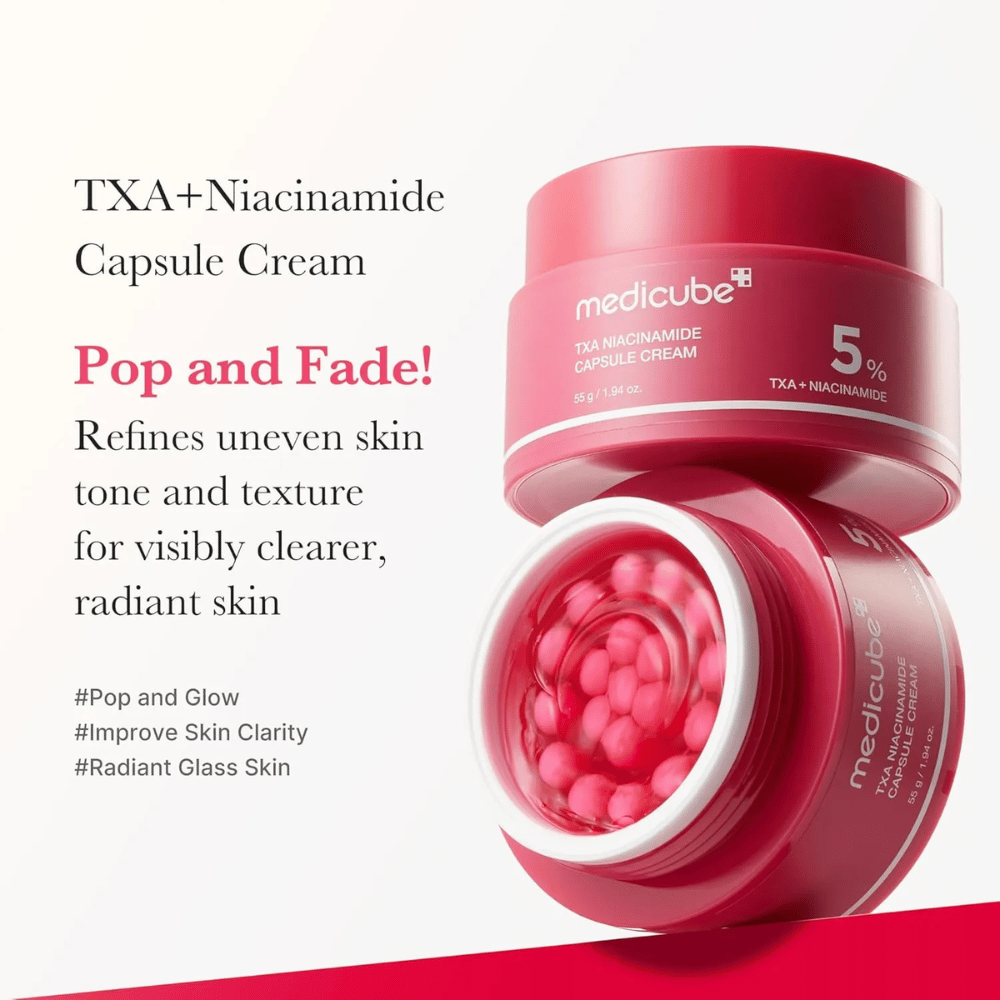Medicube TXA Niacinamide Capsule Cream tekstillä ihonsävyn tasoittamisesta ja hehkusta, näyttää avoimen purkin vaaleanpunaisilla kapseleilla ja tuotteen pakkauksen vieressä.